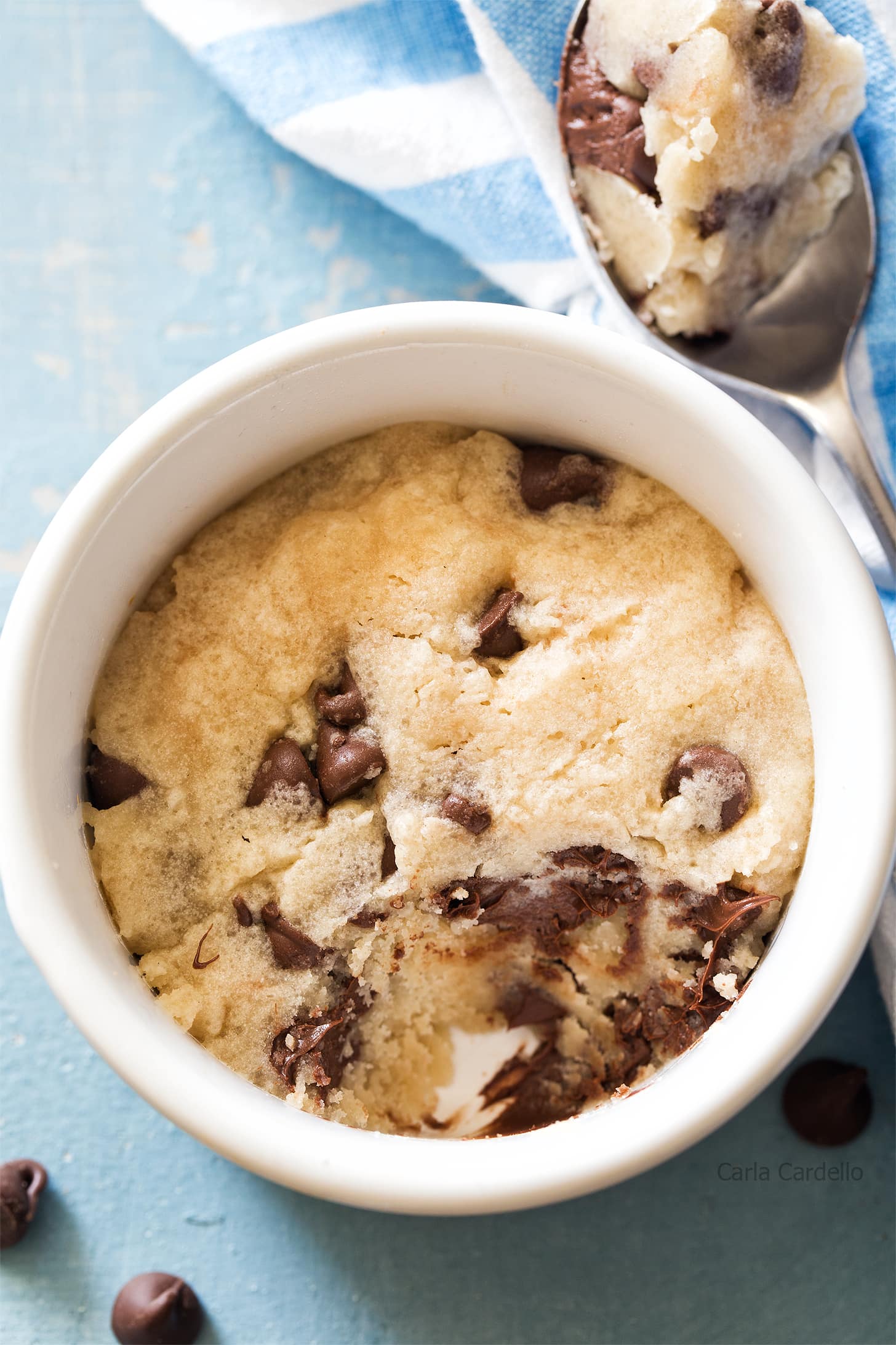 Overhead shot of microwave chocolate chip cookie with spoon