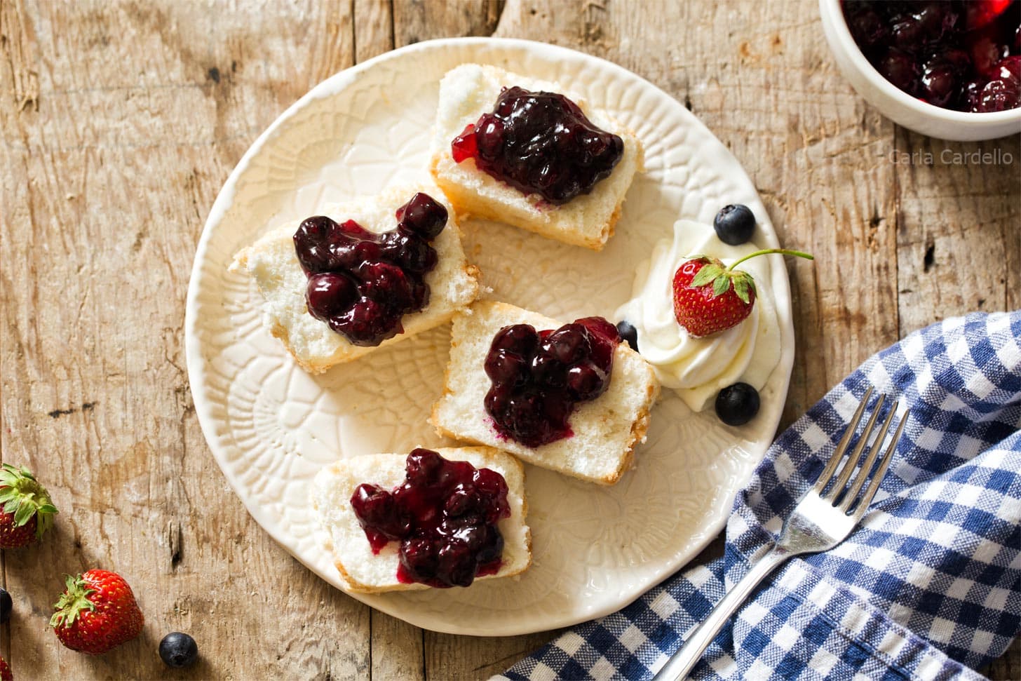 Slices of angel food cake with blueberry pie filling