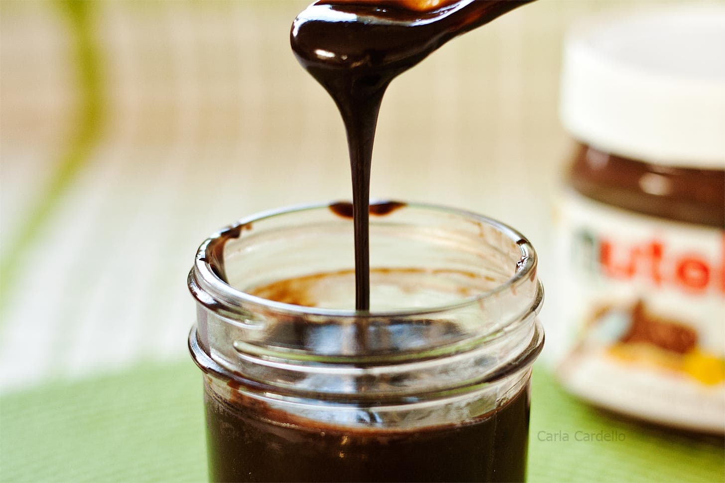 Nutella Sauce drizzling back into its jar