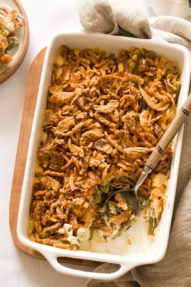 Homemade green bean casserole with serving spoon