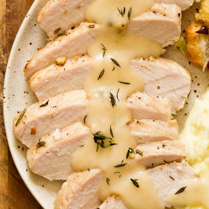 Sliced turkey breast with homemade turkey gravy on top