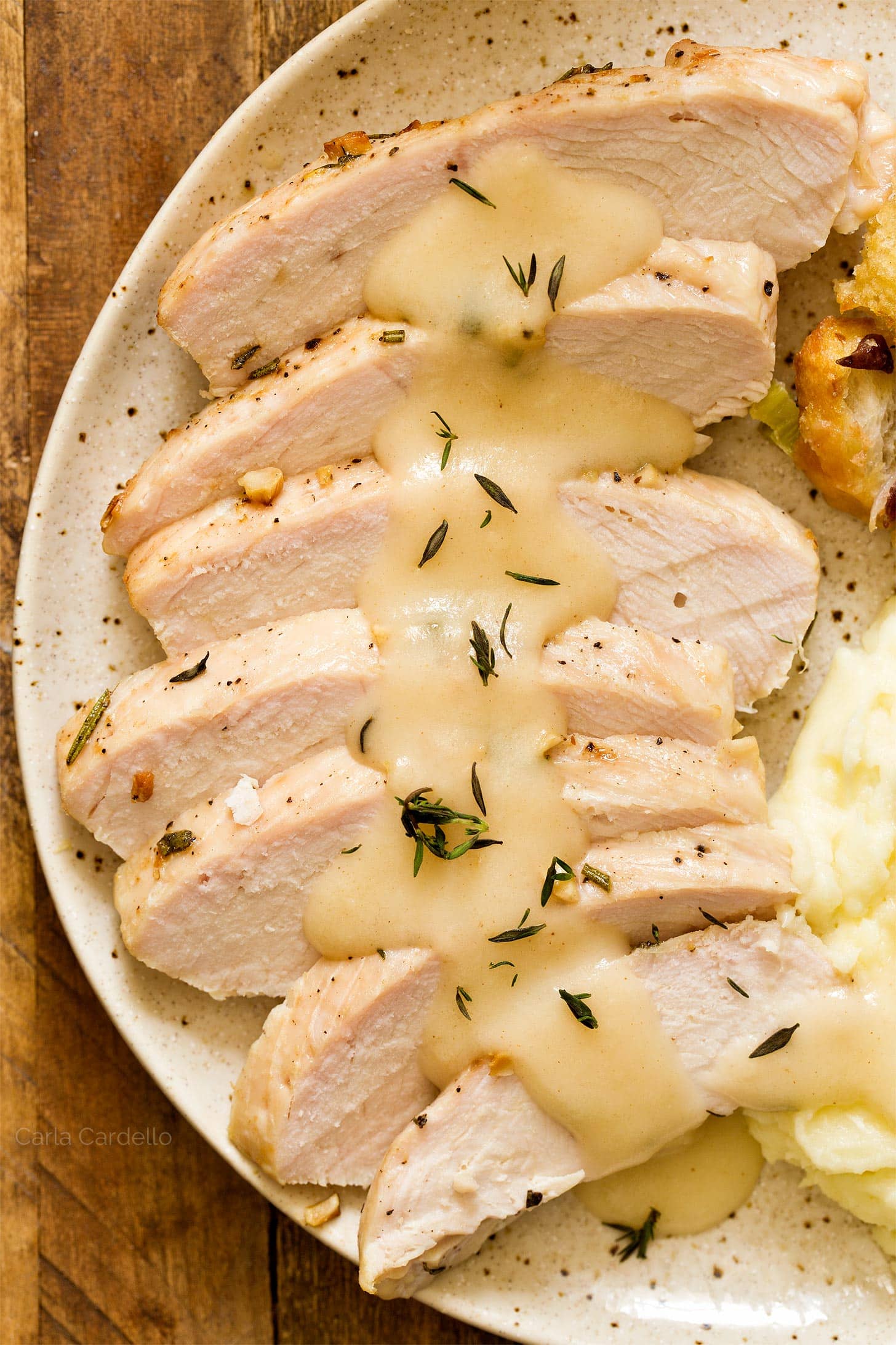 Sliced turkey breast with homemade turkey gravy on top