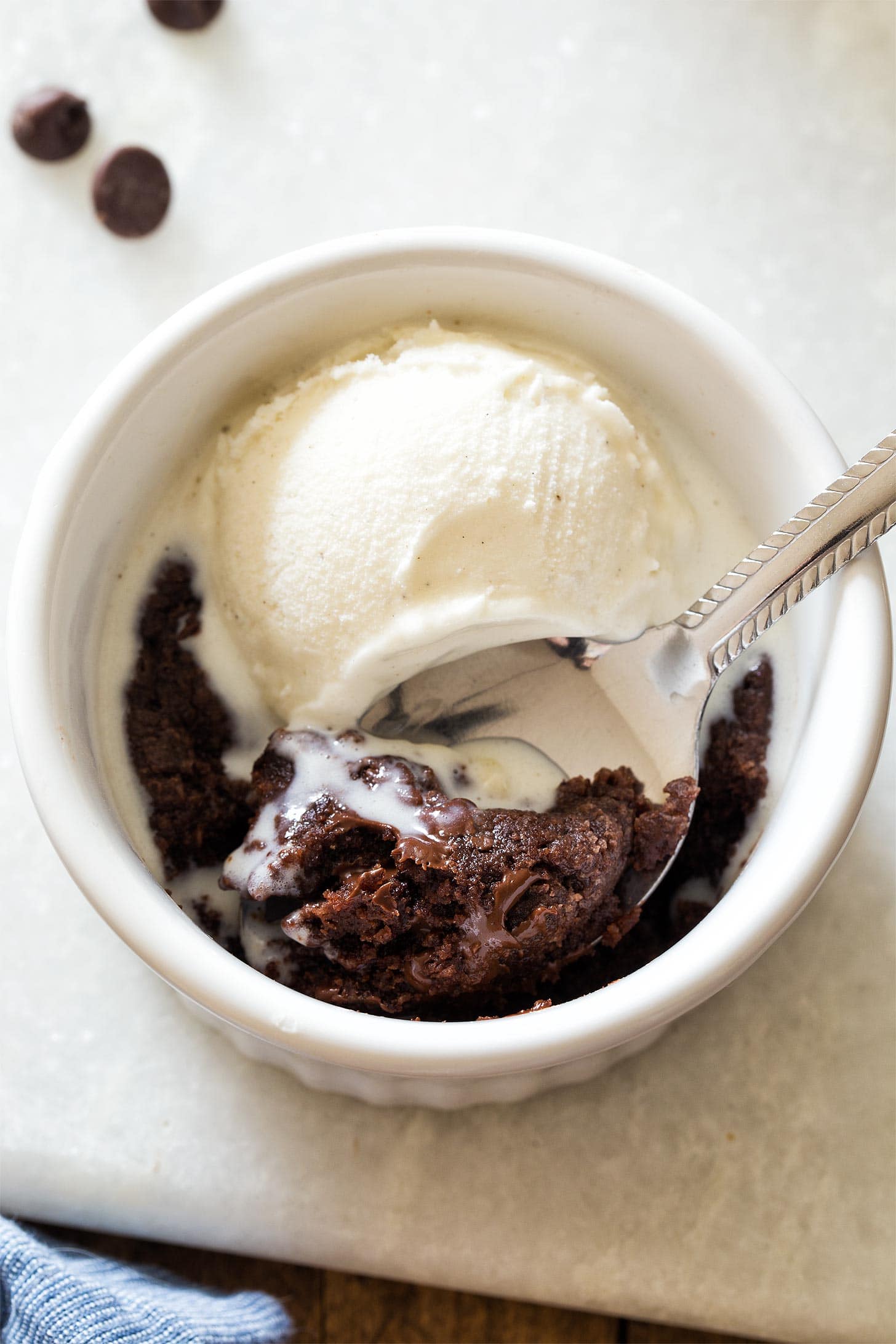 Microwave Brownie with vanilla ice cream in ramekin