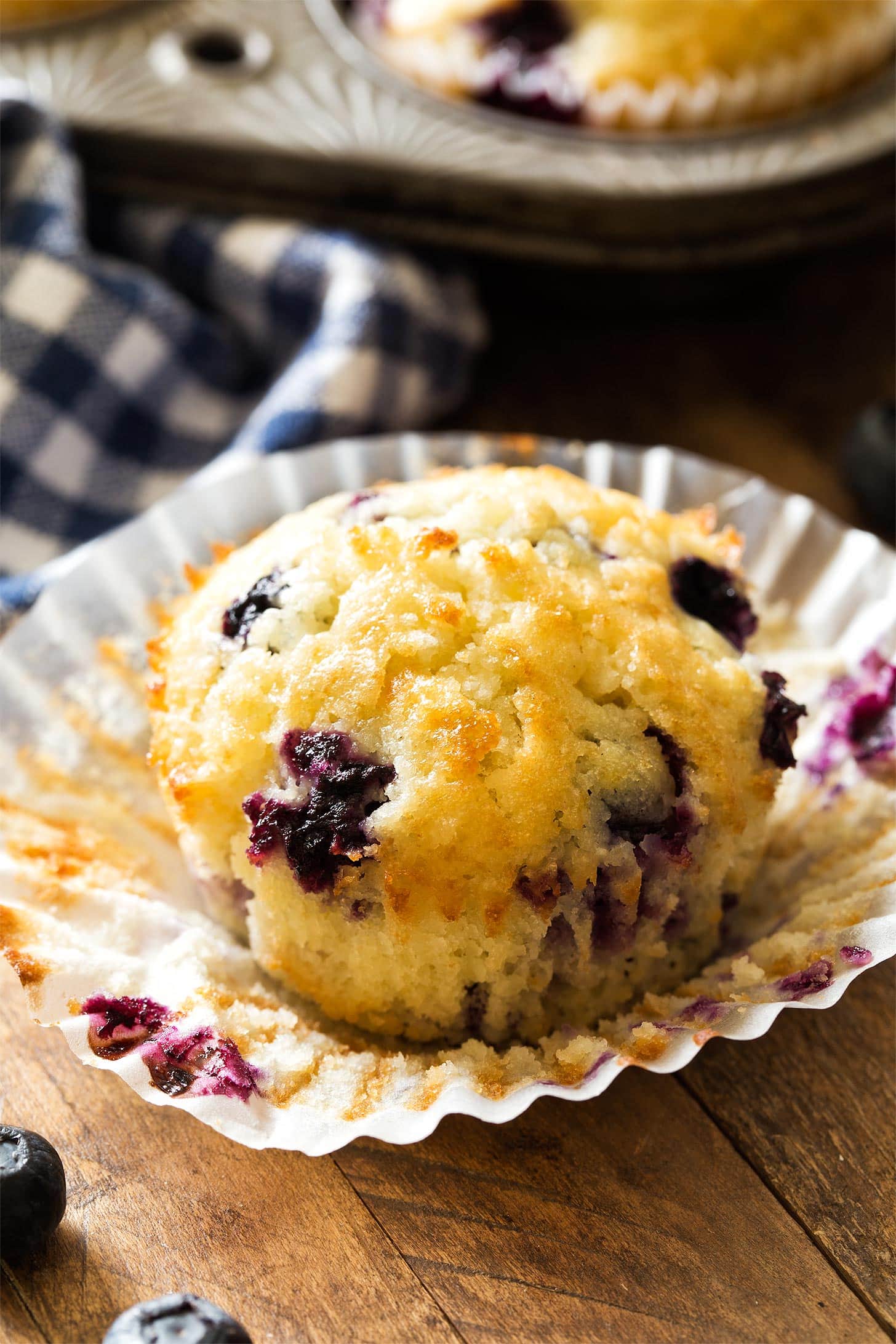 Close up of unwrapped blueberry muffin
