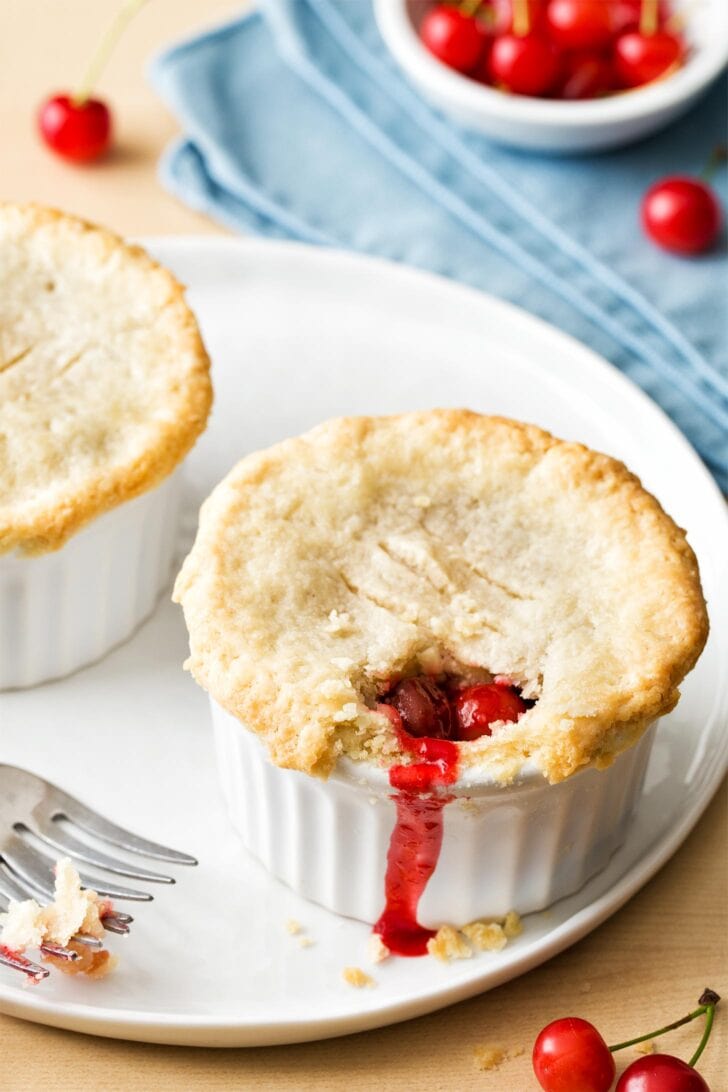 Close up of mini cherry pie on white plate