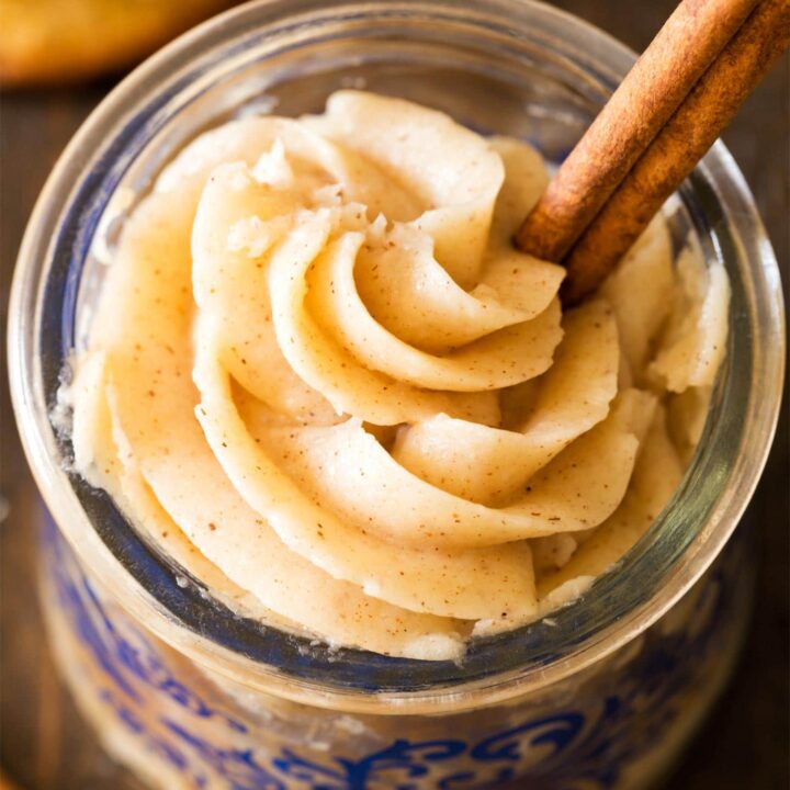 Cinnamon frosting in jar with cinnamon stick