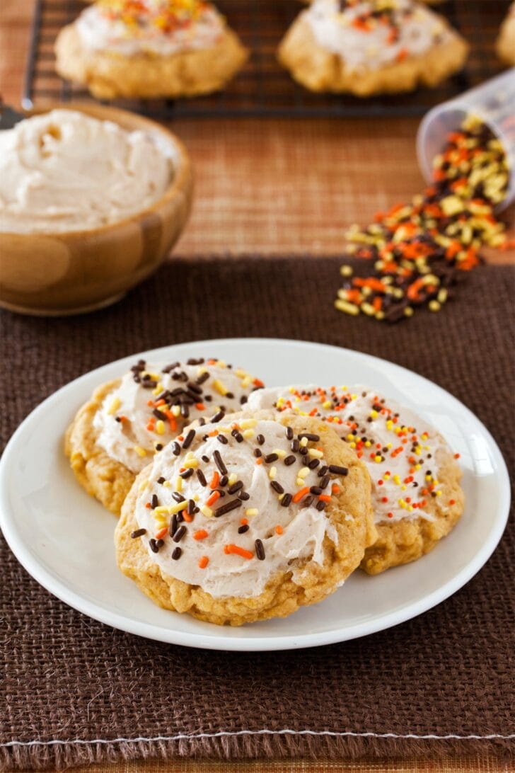 Cinnamon buttercream on pumpkin sugar cookies