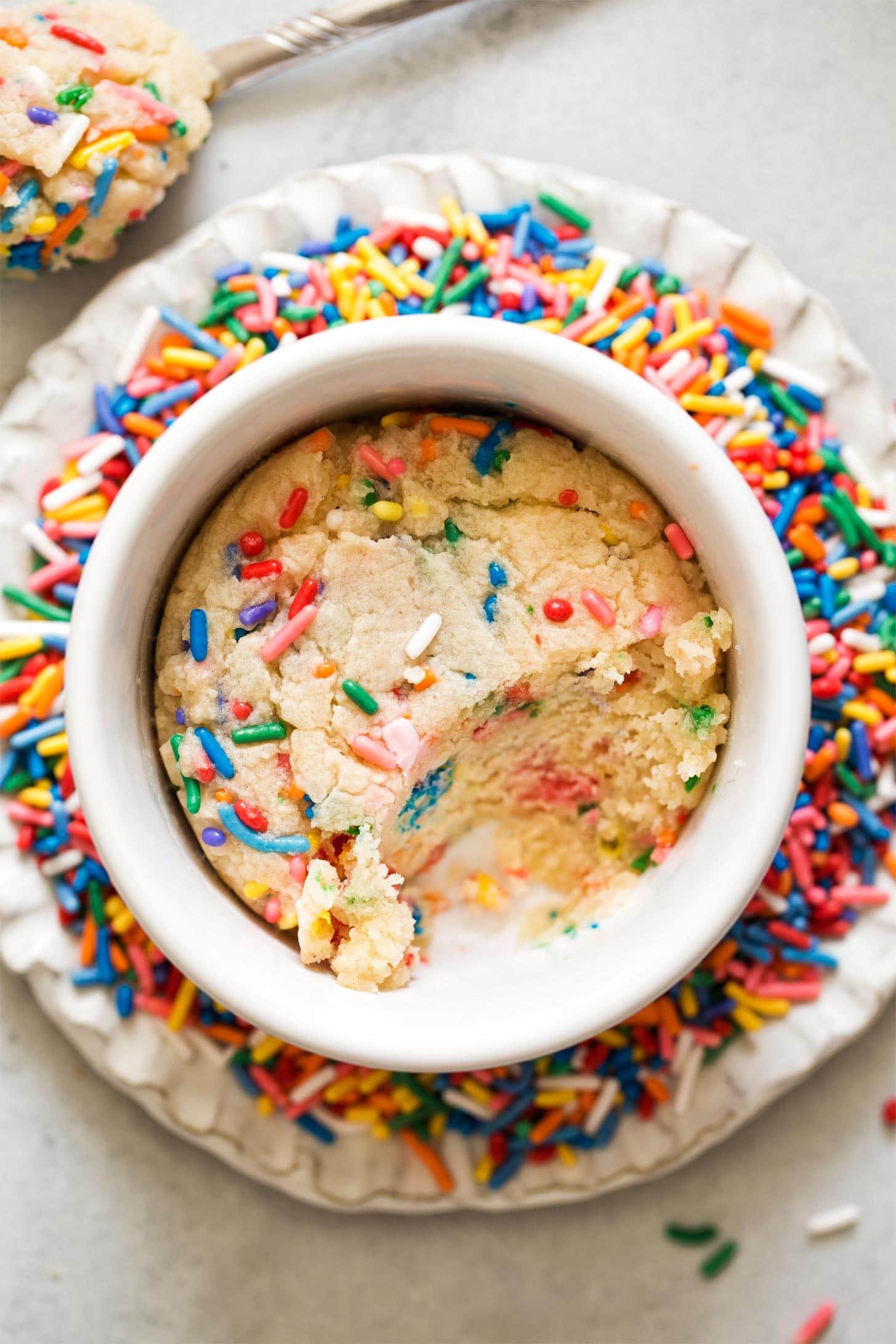 Microwave Sugar Cookie with a spoonful taken out
