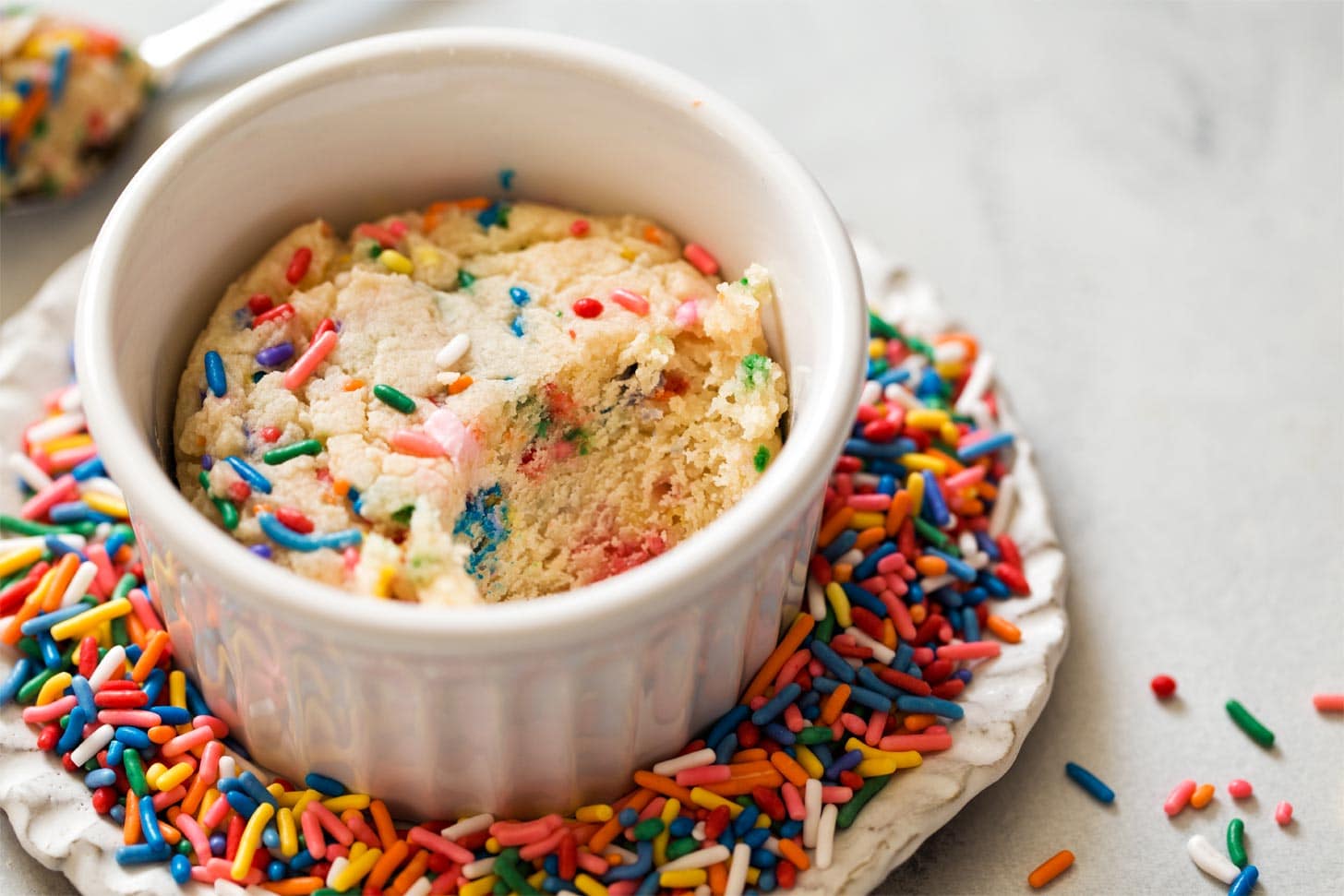 Single Serving Sugar Cookie on a plate of sprinkles