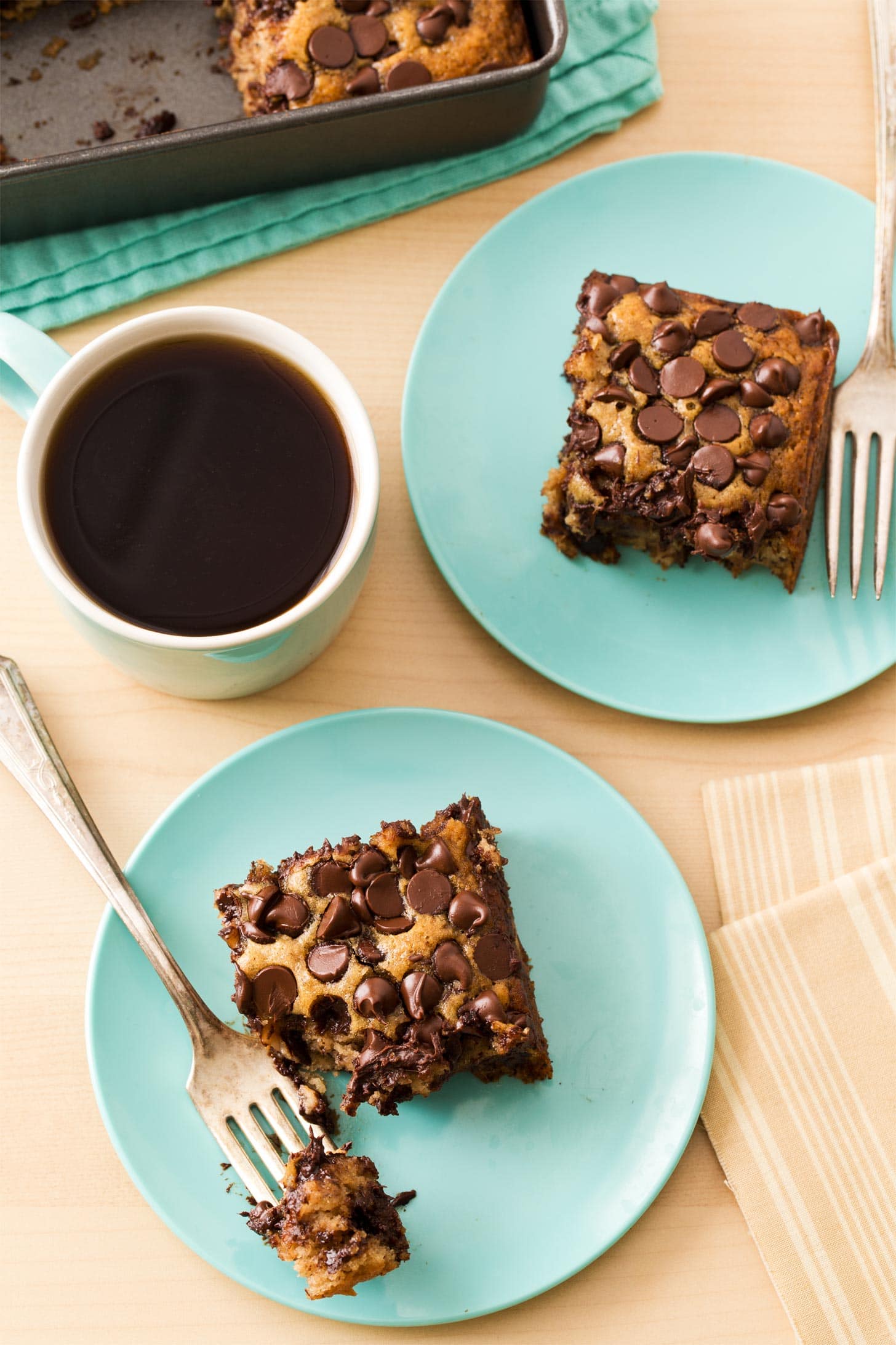 Banana Snack Cake slices on blue plates