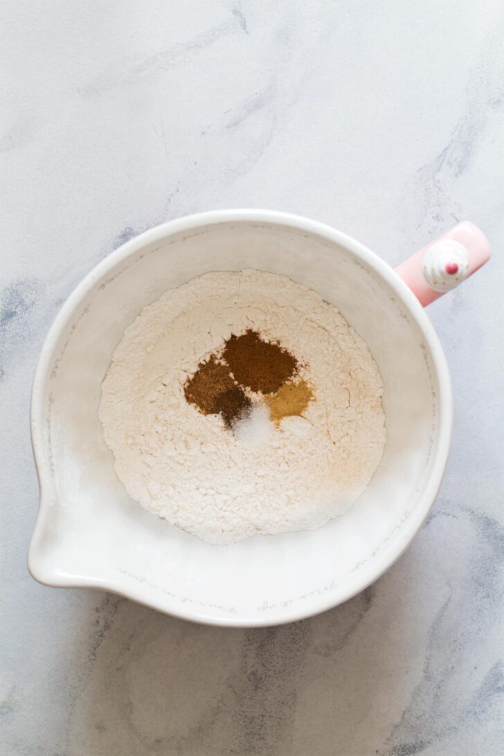 Combining dry ingredients to make pumpkin biscotti