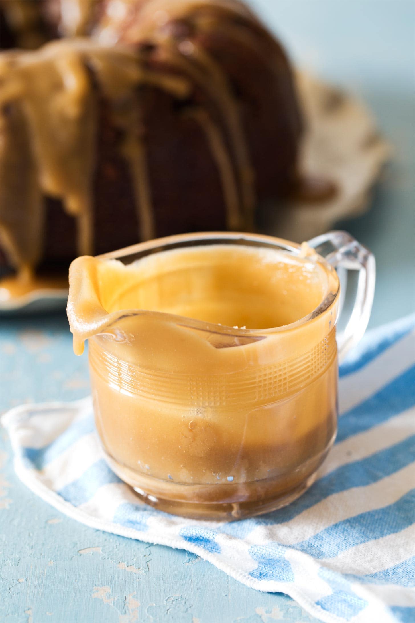 Glass pitcher filled with caramel glaze