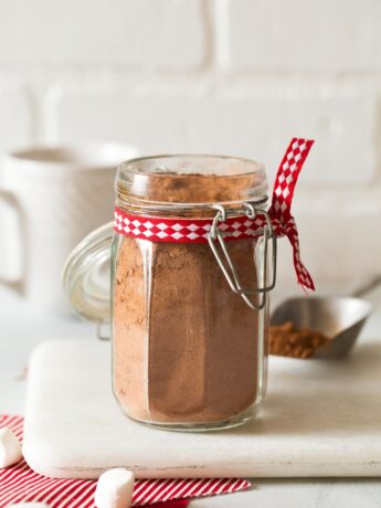 Jar of homemade hot chocolate mix with Christmas ribbon