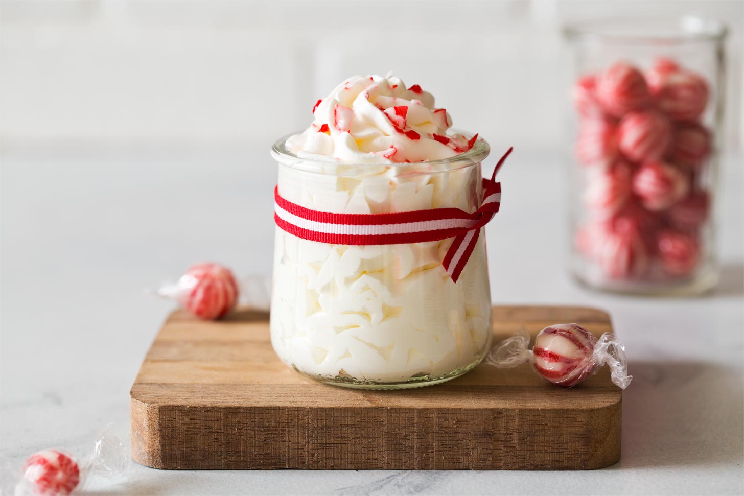 Wide shot of peppermint whipped cream on wooden board