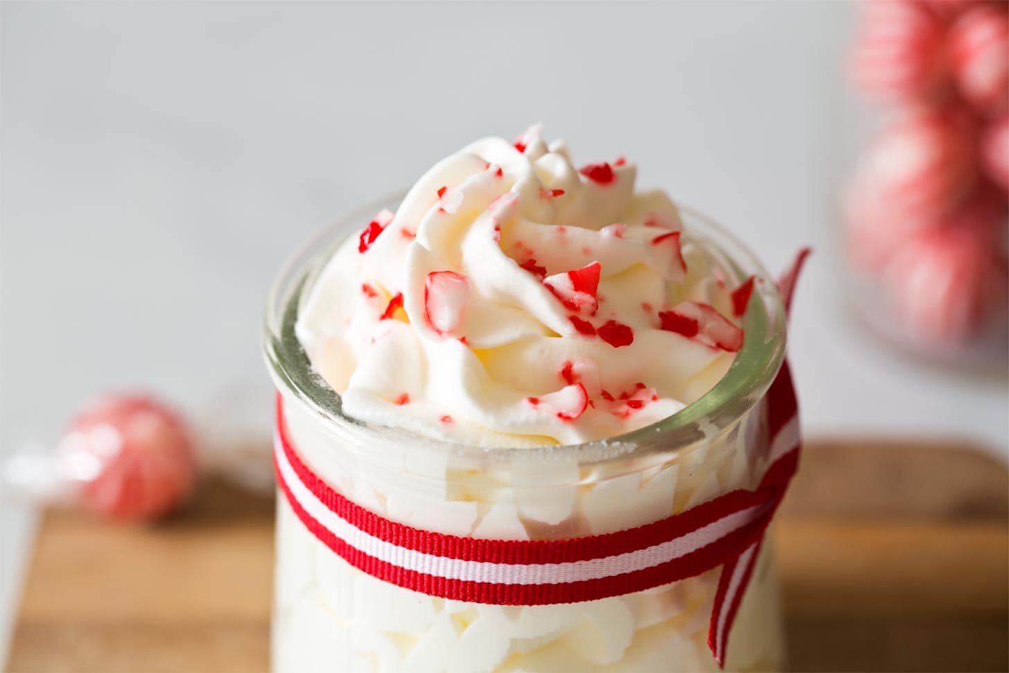 Close up of candy cane whipped cream in jar