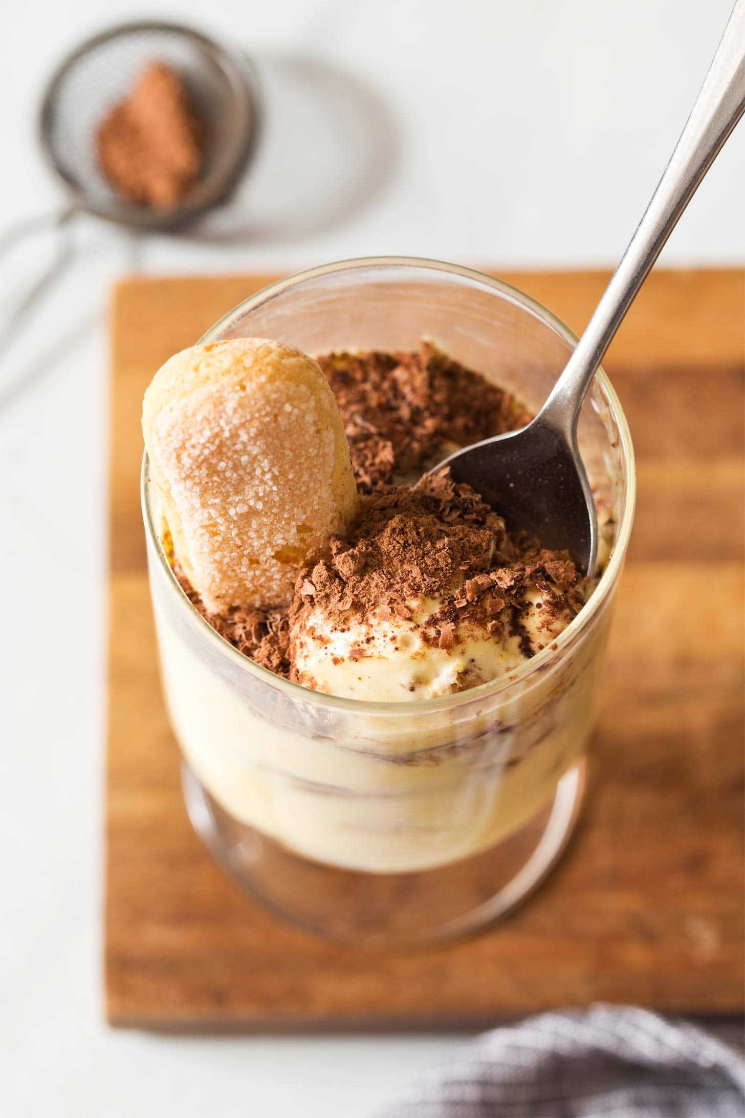 Spoon inside individual tiramisu
