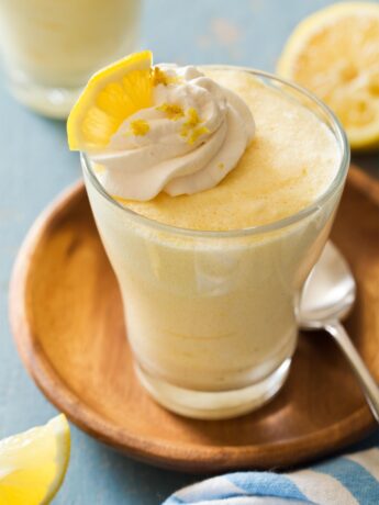 Lemon mousse in a cup with whipped cream