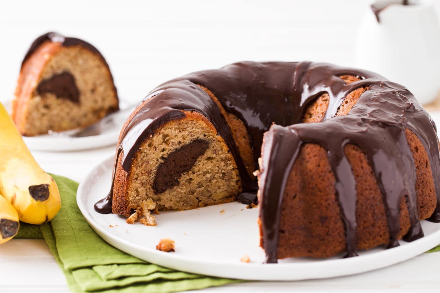 Banana Bread Bundt Cake with slice cut out