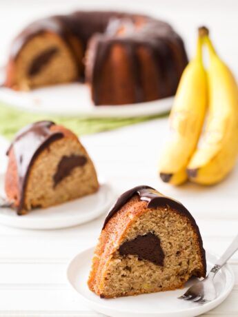 Slices of banana bundt cake with chocolate filling and ganache glaze