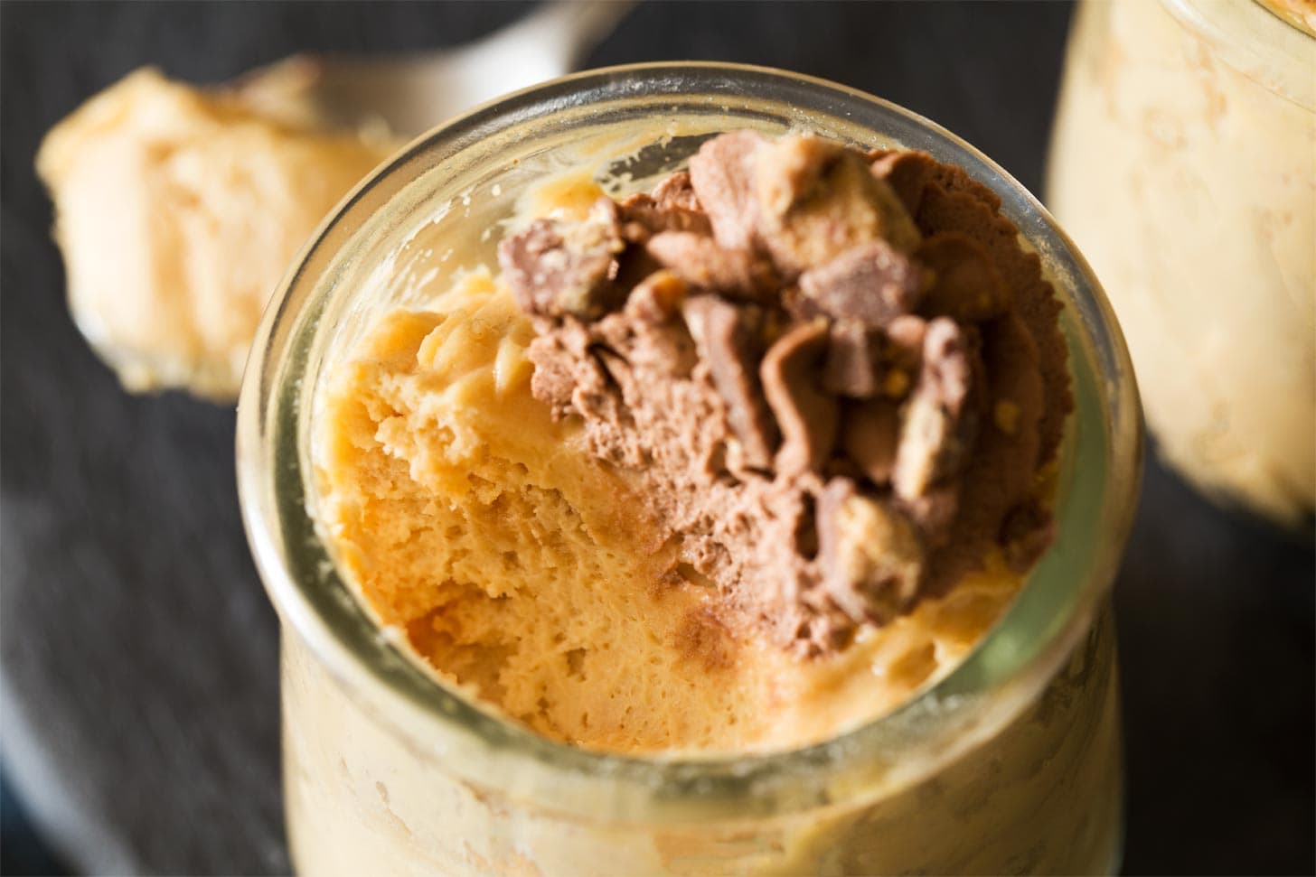 Close up of chocolate peanut butter mousse with bite taken