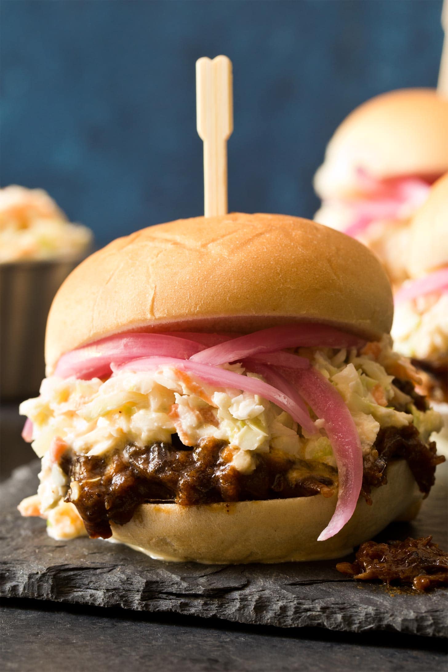 Close up of creamy coleslaw on beef sliders