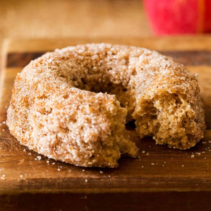 Baked apple cider donut with bite taken out