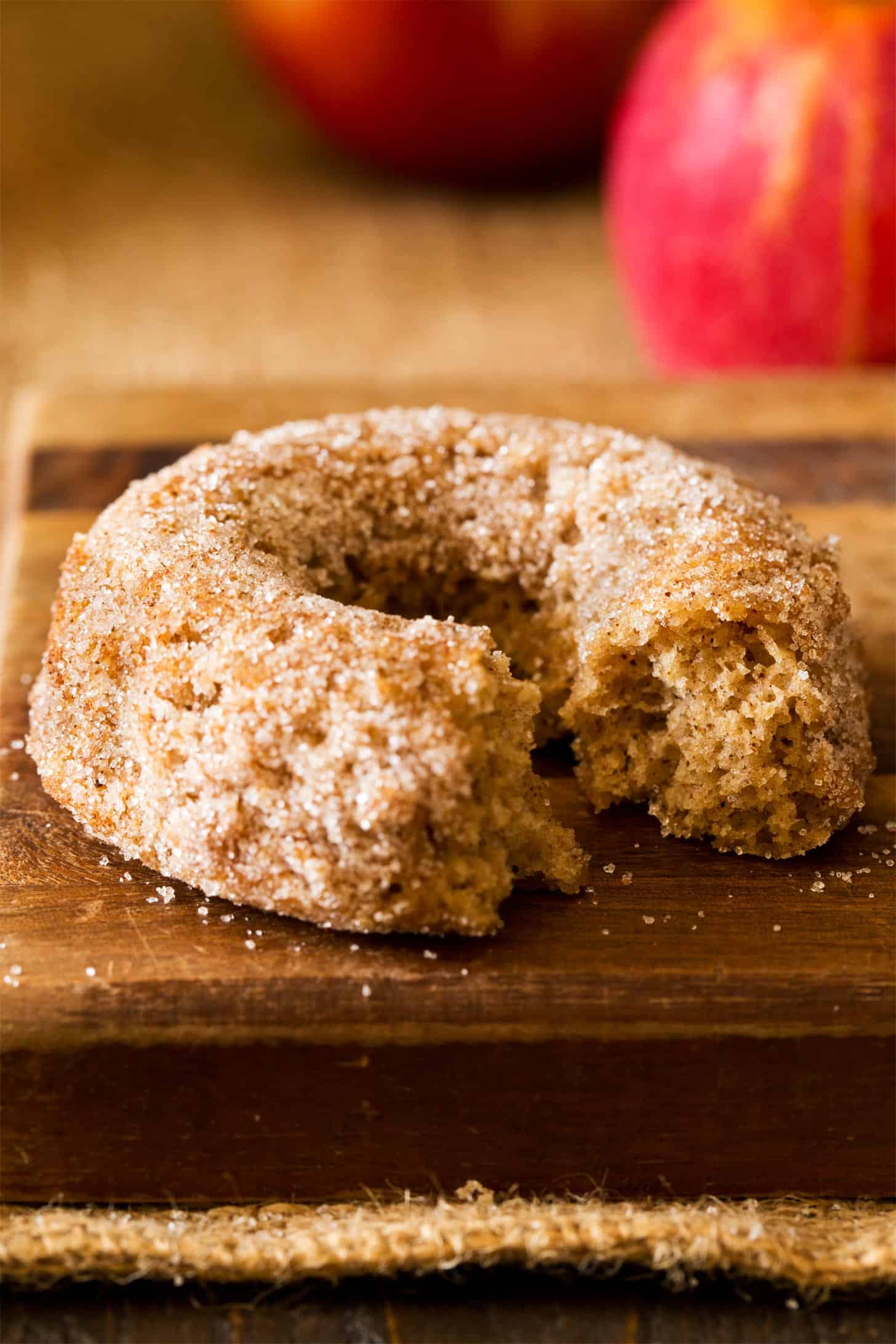Baked apple cider donut with bite taken out