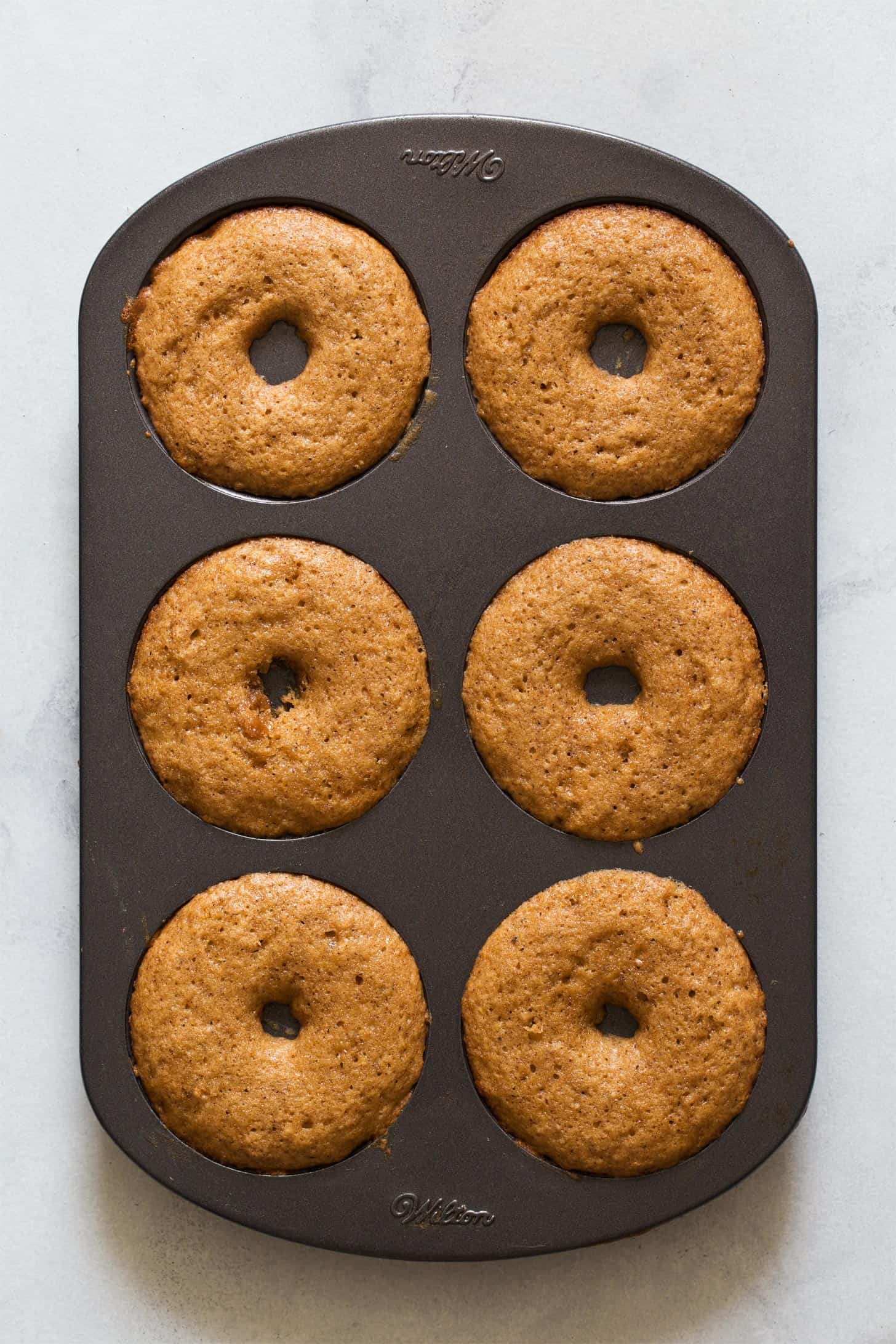 Apple cider donuts baked in donut pan
